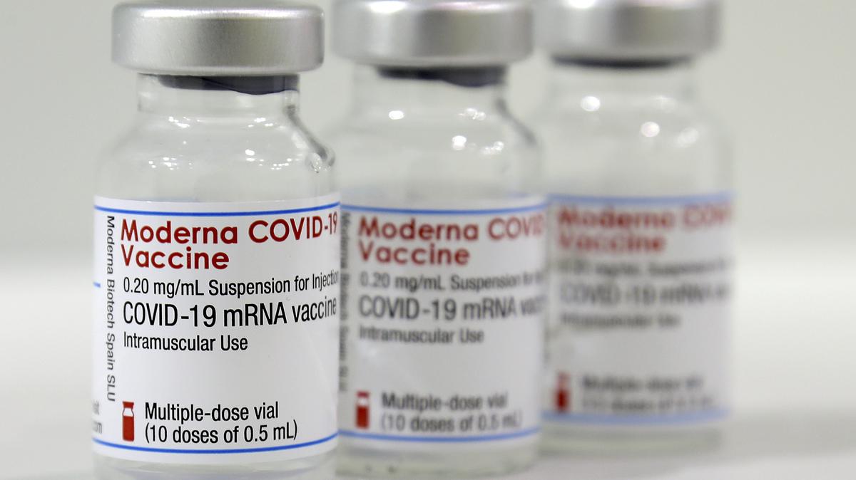 Three vials of the Moderna COVID-19 vaccine are pictured on Feb. 17, 2021.  (Michael Sohn - Pool/Getty Images/TNS)