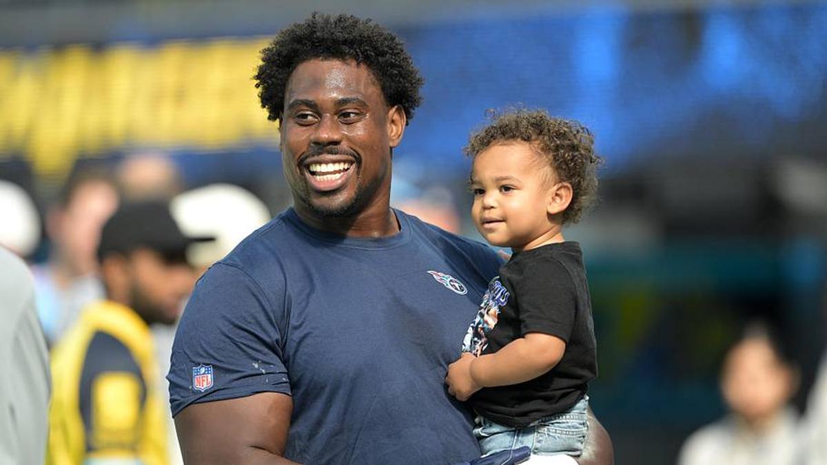  Nov 10, 2024; Inglewood, California, USA; Tennessee Titans defensive tackle Sebastian Joseph-Day (69) holds his 16-month old son Lennox prior to the game against the Los Angeles Chargers at SoFi Stadium. Mandatory Credit: Jayne Kamin-Oncea-Imagn Images | Jayne Kamin-Oncea-Imagn Images 