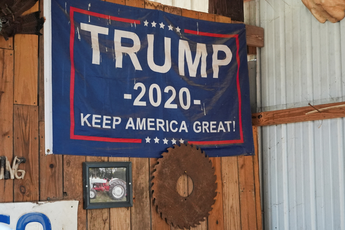 A Trump 2020 flag hangs from a wall inside the barn of Republican farmer Don Westlake in Cedartown, Georgia, U.S.,. February 9, 2026. REUTERS/Jayla Whitfield-Anderson