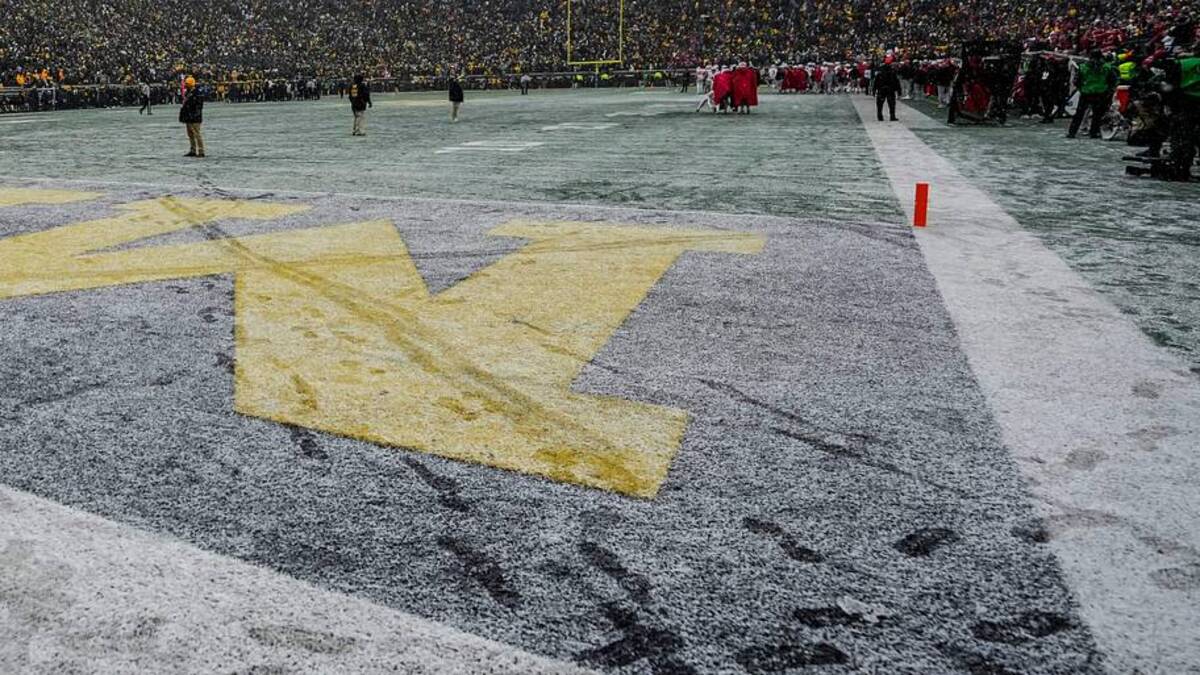  An M in the endzone is crossed out in snow by Ohio State mascot Brutus during the NCAA football game at Michigan Stadium in Ann Arbor, Mich. on Nov. 29, 2025. Ohio State won 27-9. | Adam Cairns/Columbus Dispatch / USA TODAY NETWORK via Imagn Images 