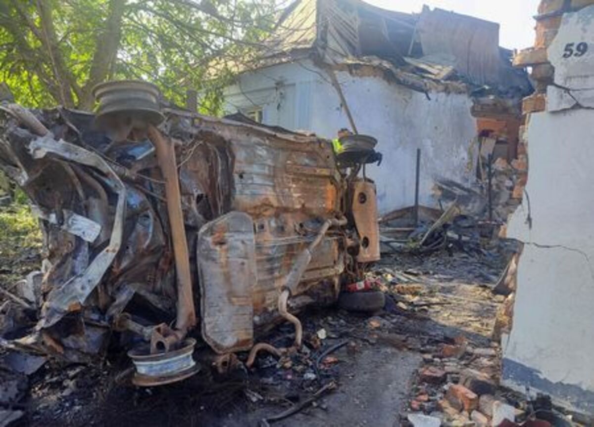 A destroyed car at a site where a house was heavily damaged by a Russian drone strike, amid Russia's attack on Ukraine, in Mykolaiv, Ukraine June 12, 2026. Picture taken with a mobile phone. REUTERS/Viktoriia Lakezina