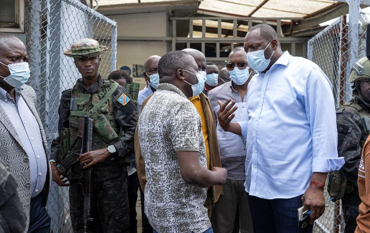 Bahati Erasto Musanga, provincial Governor, talks with Laurence Kanyuka, spokesperson for the M23 rebel group, and their delegation, as they leave the Rodolphe Merieux Laboratory, National Biomedical Research Institute (INRB), where samples from suspected Ebola cases are being tested, during a visit by provincial authorities as part of the response in the city of Goma, North Kivu province, in the eastern Democratic Republic of the Congo, May 19, 2026. REUTERS/Arlette Bashizi