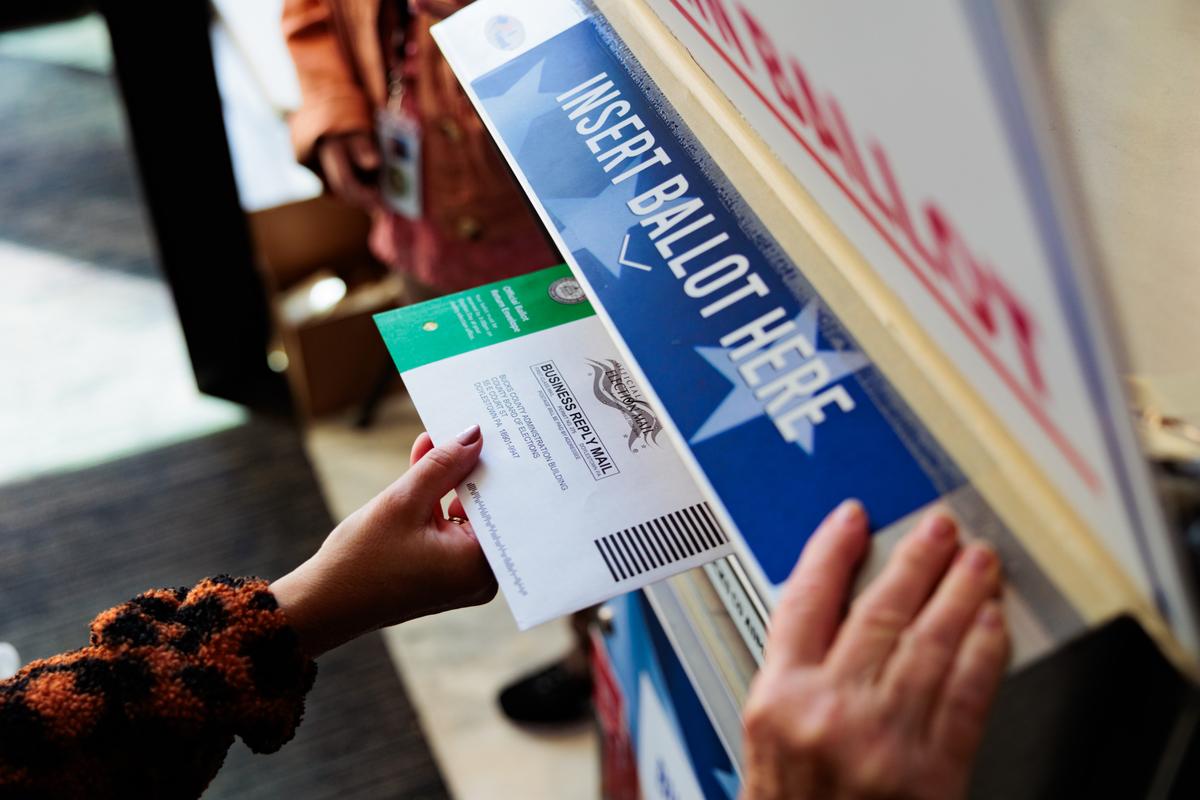  A voter submits a mail-in ballot in Doylestown, Pennsylvania, on October 15. 