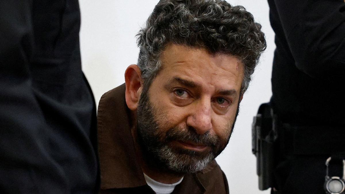 FILE PHOTO: Activist Saif Abu Keshek, a Spanish national, who was detained aboard the Gaza-bound Global Sumud Flotilla, which was intercepted by Israeli forces in international waters, appears at a court in Beersheba, southern Israel May 6, 2026. REUTERS/Amir Cohen/File Photo