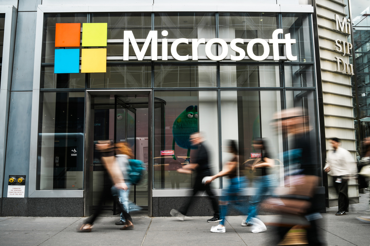  People walk past a Microsoft store in New York City on March 31, 2026. 
