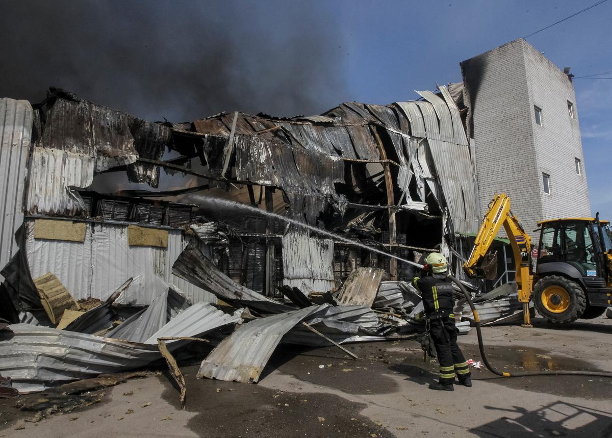 A firefighter works at a site of a Russian missile strike, amid Russia's attack on Ukraine, in Dnipro, Ukraine May 20, 2026. REUTERS/Stringer
