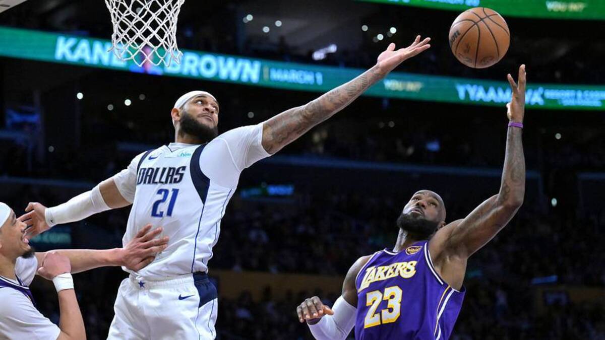  Feb 12, 2026; Los Angeles, California, USA; Dallas Mavericks forward Daniel Gafford (21) and Los Angeles Lakers forward LeBron James (23) reach for a rebound in the second half at Crypto.com Arena. Mandatory Credit: Jayne Kamin-Oncea-Imagn Images | Jayne Kamin-Oncea-Imagn Images 