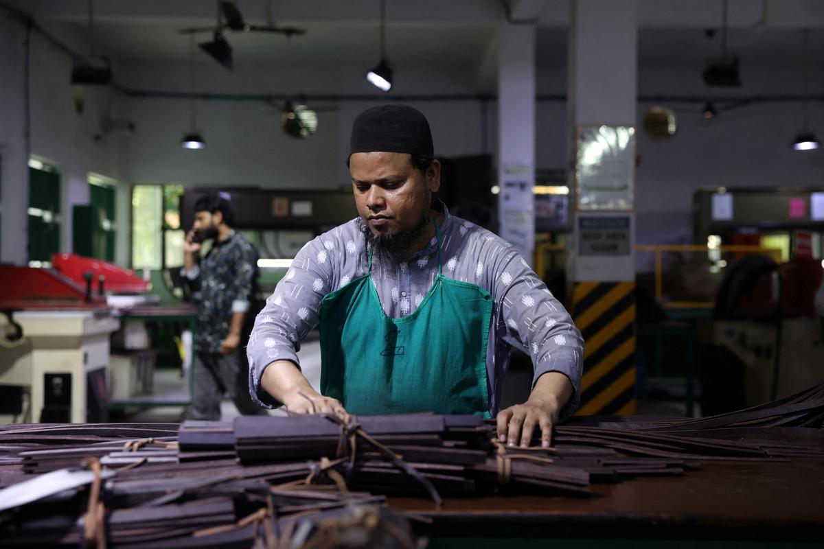 A worker prepares to cut leather pieces inside a leather factory of Kings International Ltd. in Kanpur, India, May 13, 2026. REUTERS/Bhawika Chhabra