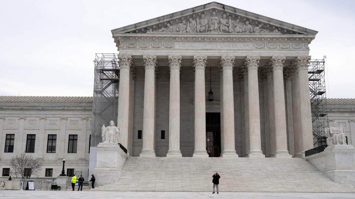 File art: People gather outside of the Supreme Court of the United States on Dec. 1, 2023.