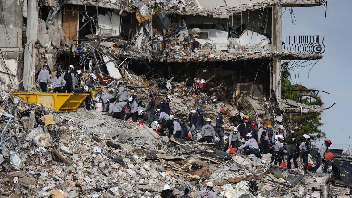 File photo of search-and-rescue teams looking for survivors at the Champlain Towers South residential condo on June 29 in Surfside.