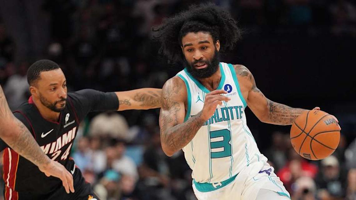 Apr 14, 2026; Charlotte, North Carolina, USA; Charlotte Hornets guard Coby White (3) goes to the basket past Miami Heat guard Norman Powell (24) during the second half during the play-in rounds between the Charlotte Hornets and the Miami Heat of the 2026 NBA Playoffs at Spectrum Center. Mandatory Credit: Jim Dedmon-Imagn Images | Jim Dedmon-Imagn Images 