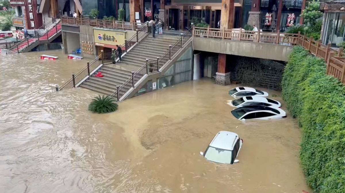 Cars lie partially submerged in floodwaters after heavy rainfall in Duyun, Guizhou Province, China, May 19, 2026, in this still image obtained from a social media video. Social Media/via REUTERS  THIS IMAGE HAS BEEN SUPPLIED BY A THIRD PARTY. NO RESALES. NO ARCHIVES.  VERIFICATION:  - Business signages, buildings, the river, the bridge and road layout matched file and satellite imagery. - Date confirmed by local authorities and no earlier version was found posted online before May 19. - The local government forecasted that urban waterways would experience flood peak passage at 6 a.m. (GMT+8) and raised the flood control emergency response to Level II on May 19.