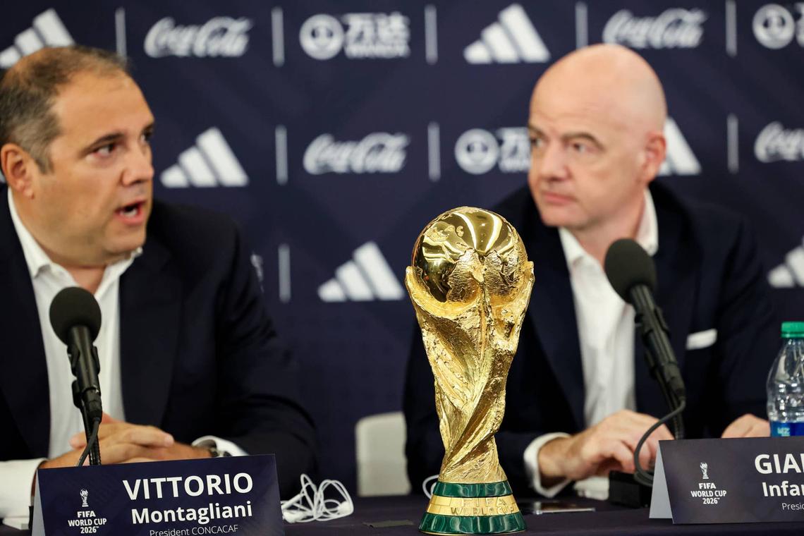 The FIFA World Cup Trophy sits on the table as President of CONCACAF Victor Montagliani speaks and FIFA President Gianni Infantino looks out during The FIFA World Cup 2026 Announcement. Jessica Alcheh-Imagn Images
