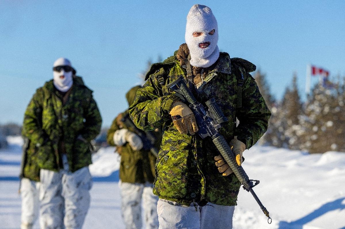 FILE PHOTO: Members of the Loyal Edmonton Regiment as part of Task Force Grizzly participate in defensive operations around Edzo Airport as Canadian Armed Forces deploy to "Operation Nanook-Nunalivut," a yearly series of drills designed to highlight the military's ability to defend the Canadian Arctic, in Behchoko, Northwest Territories, Canada February 18, 2026. REUTERS/Carlos Osorio/File Photo