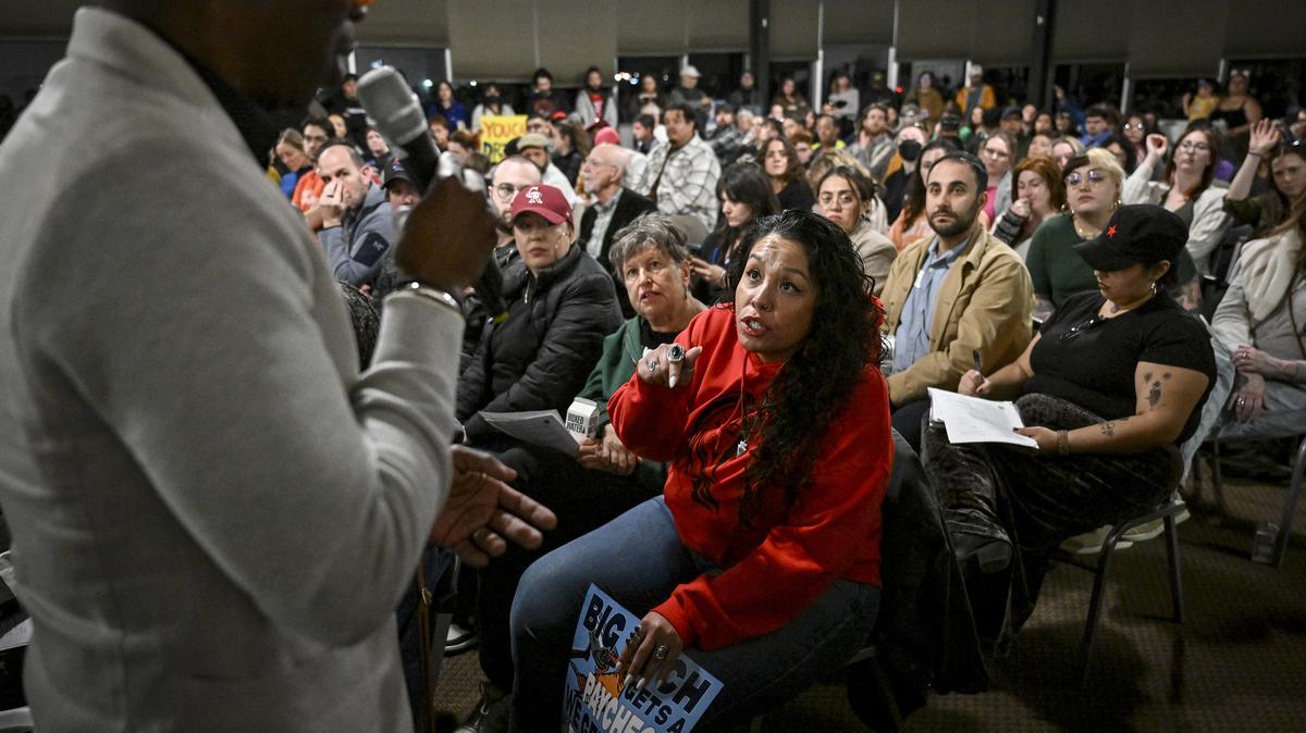 Renee Chacon challenges Denver City Councilman Darrell Watson, left, during a public meeting at Geotech Environmental to discuss community concerns about a new data center in Denver on Feb. 24, 2026. (AAron Ontiveroz/The Denver Post/TNS)
