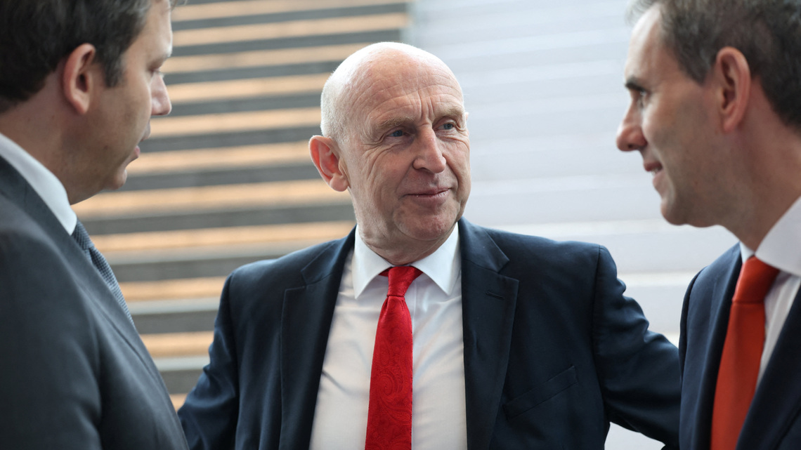 UK's Healey says banks are key to economy but keeps tax options open