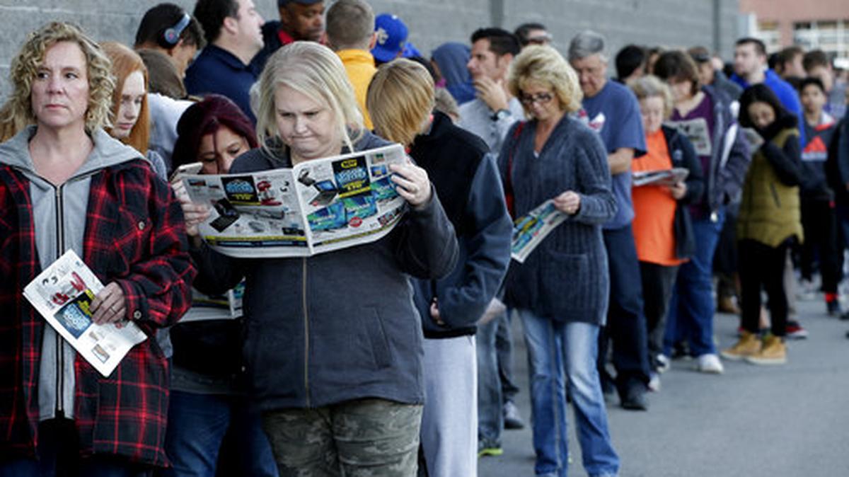 People wait in line for a Best Buy store to open for a Black Friday sale on Thanksgiving Day. A solid 70 percent of Americans plan to shop on Black Friday this year, according to a recent NerdWallet study conducted by The Harris Poll.
