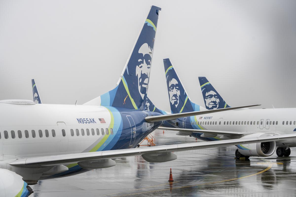 An Alaska Airlines Boeing 737 Max 9 jets on the tarmac at Seattle-Tacoma International Airport on Jan. 8, 2024. Members of Alaska’s Atmos Awards program can take advantage of its  Wine Flies Free program.