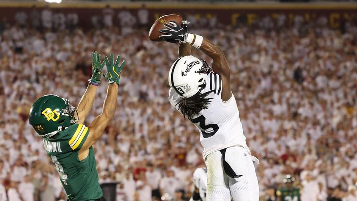  Oct 5, 2024; Ames, Iowa, USA; Iowa State Cyclones defensive back Jontez Williams (3) intercepts a pass intended for Baylor Bears wide receiver Monaray Baldwin (4) at Jack Trice Stadium. Mandatory Credit: Reese Strickland-Imagn Images | Reese Strickland-Imagn Images 