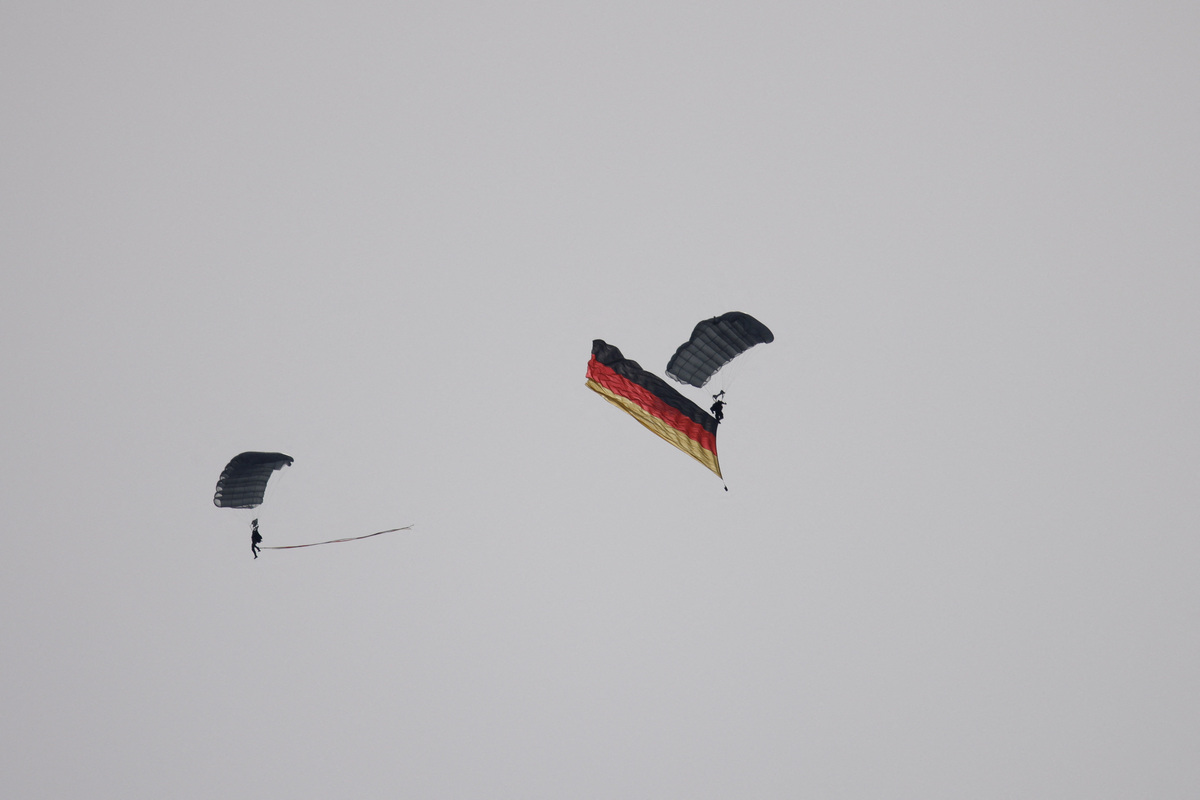 Members of the German air force parachute with a German flag during the International Aerospace Exhibition ILA on the opening day at Schoenefeld Airport in Berlin, Germany, June 10, 2026. REUTERS/Axel Schmidt