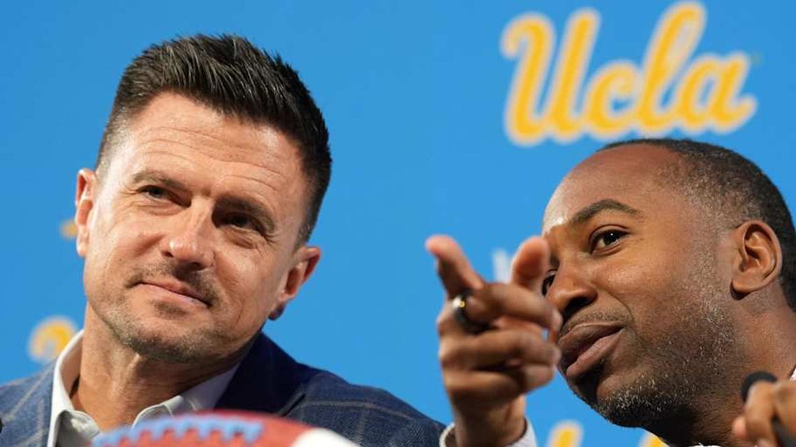  Dec 9, 2025; Los Angeles, CA, USA; UCLA Bruins football coach Bob Chesney (left) and athletic director Martin Jarmond at introductory press conference at Renee Luskin Conference Center Centennial Ballroom. Mandatory Credit: Kirby Lee-Imagn Images | Kirby Lee-Imagn Images 
