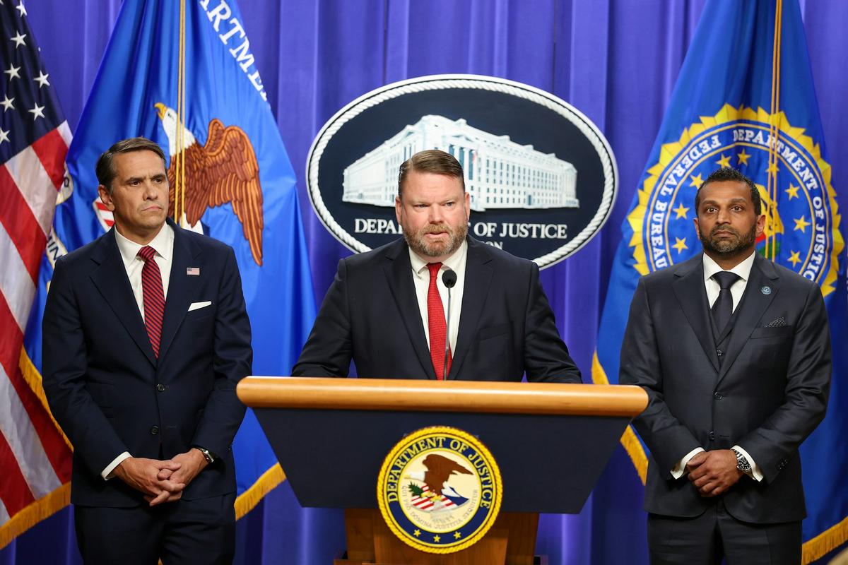  Ellis Boyle, U.S. attorney for the Eastern District of North Carolina, is flanked by acting Attorney General Todd Blanche, left, and FBI Director Kash Patel at a press conference on April 28, 2026, concerning charges against James Comey. Tasos Katopodis/Getty Images 