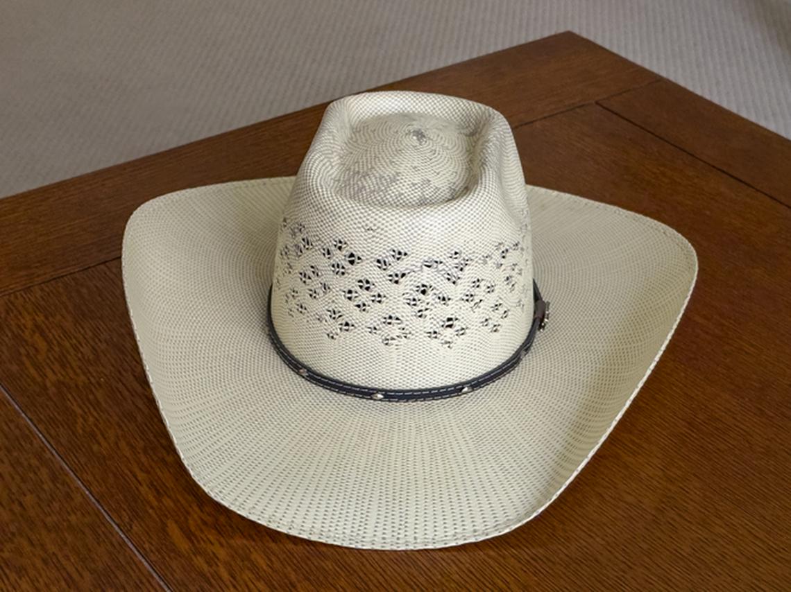 Straw hat for horseback riding. Photo credit: Julie Diebolt Price