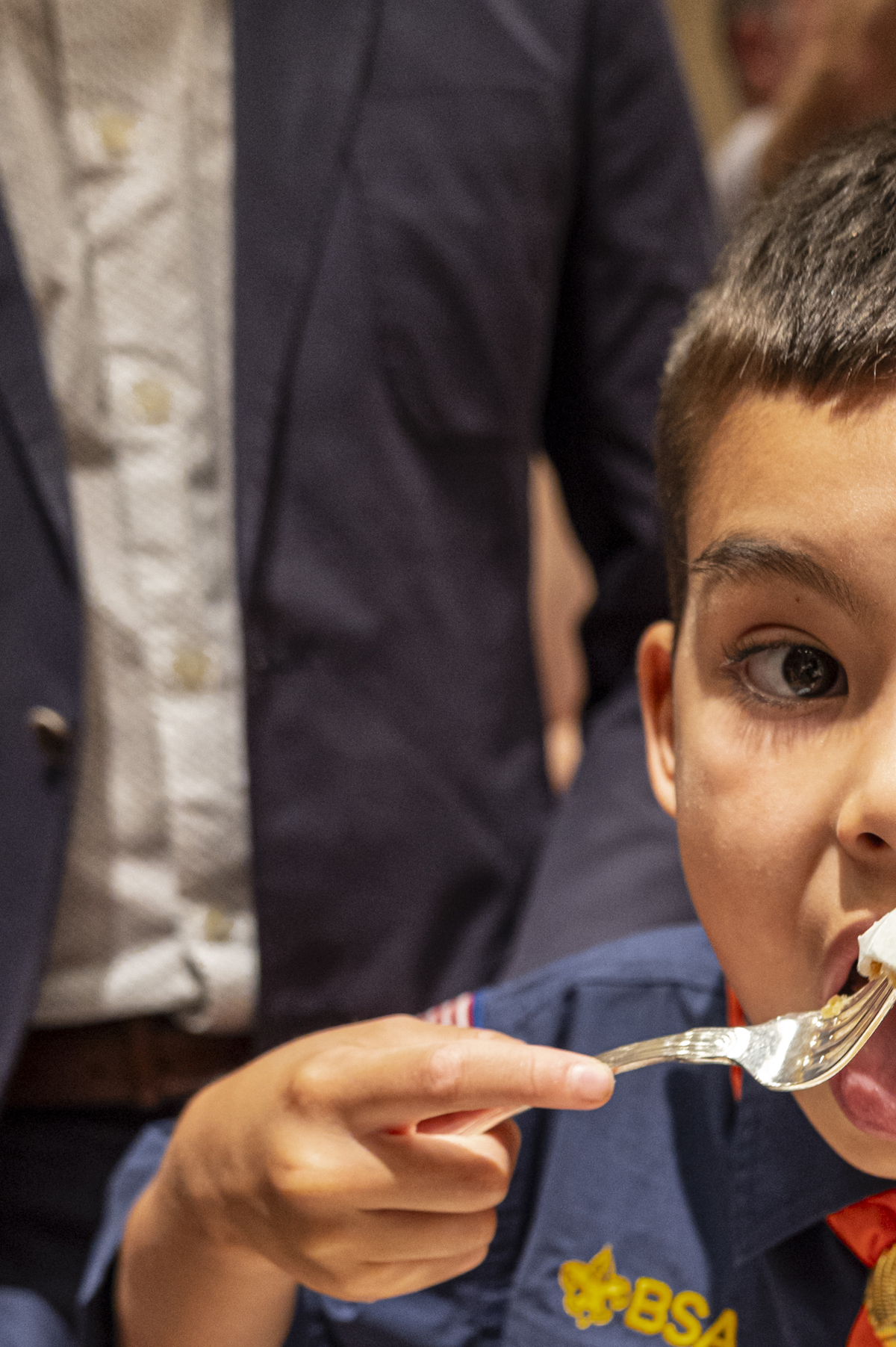 Cub Scout Harrison Yang, 7, enjoys a slice of "America's birthday cake", at the Library of Congress in Washington, on Saturday, July 4, 2026. America celebrates the 250th anniversary of its independence today, with people from one end of the country to the other marking the milestone with fireworks, parades and concerts. (Scott Schuman/The New York Times)