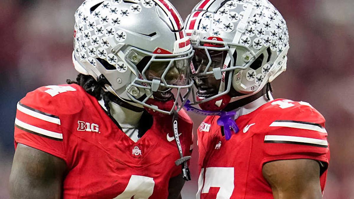  Ohio State Buckeyes wide receiver Jeremiah Smith (4) celebrates with wide receiver Carnell Tate (17) during the first half of the Big Ten Conference championship game against the Indiana Hoosiers at Lucas Oil Stadium in Indianapolis on Dec. 6, 2025. | Adam Cairns/Columbus Dispatch / USA TODAY NETWORK via Imagn Images 