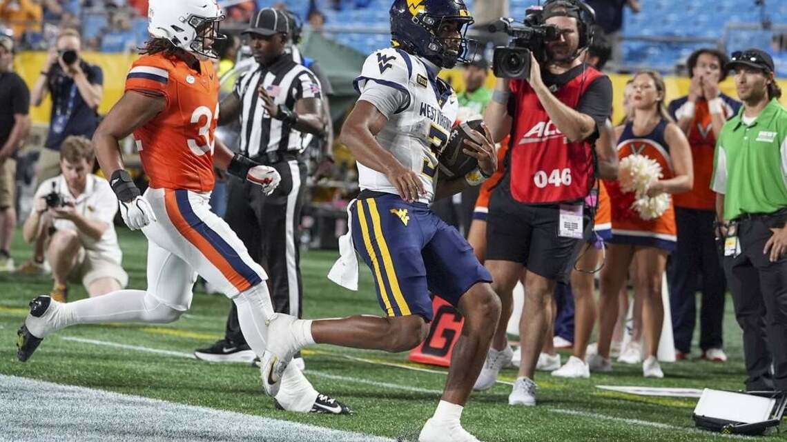 QB Michael Hawkins carries West Virginia to upset of No. 25 Virginia 
