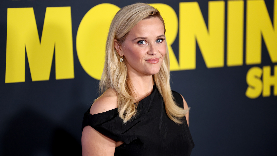 Reese Witherspoon Wore a Loose Black Dress With Boots - The $33 Look 