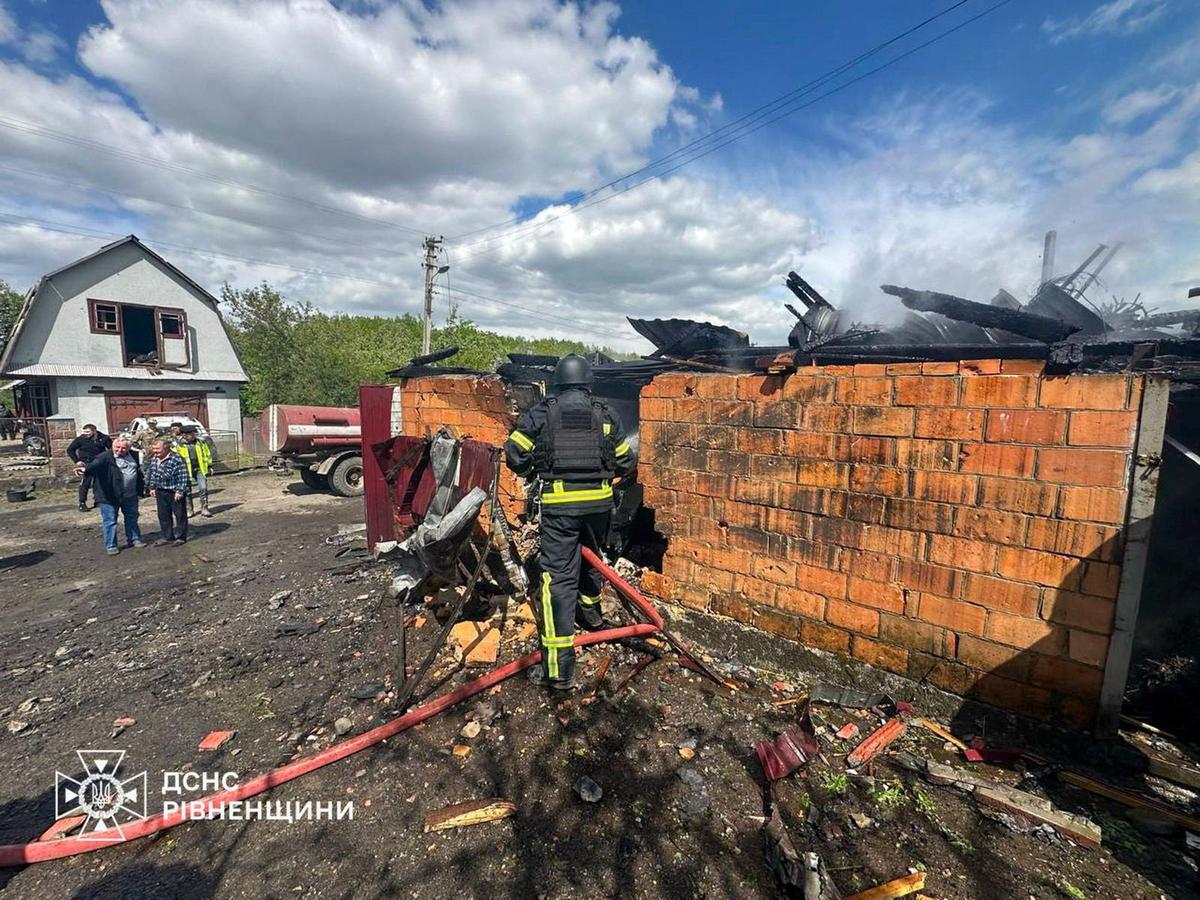 A firefighter works at the site of a residential building damaged during a Russian drone strike, amid Russia's attack on Ukraine, in Rivne region, Ukraine May 13, 2026. Press service of the State Emergency Service of Ukraine in Rivne region/Handout via REUTERS