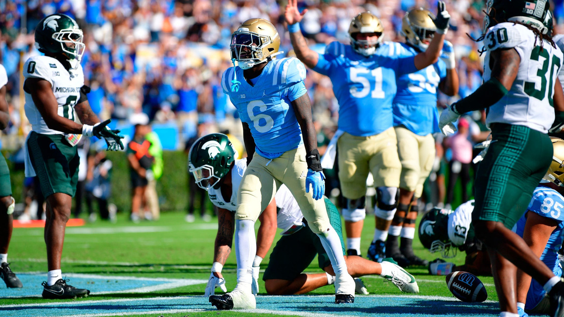UCLA RB core 'feed off each other' according to senior Anthony Woods 