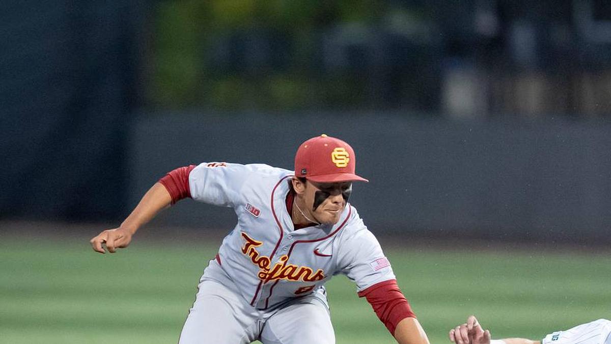  USC's Kevin Takeuchi, left, tags Oregon infielder Ryan Cooney as he slides to second as the Oregon Ducks host the USC Trojans on May 14, 2026, in Eugene, Oregon. | Ben Lonergan/The Register-Guard / USA TODAY NETWORK via Imagn Images 
