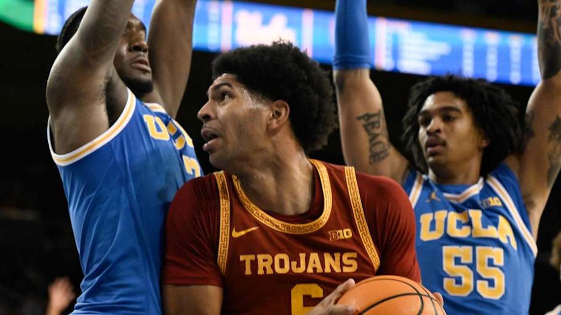  Feb 24, 2026; Los Angeles, California, USA; Southern California Trojans forward Jacob Cofie (6) drives to the basket between UCLA Bruins guard Eric Dailey Jr. (3) and guard Skyy Clark (55) during the first half at Pauley Pavilion presented by Wescom Financial. Mandatory Credit: Robert Hanashiro-Imagn Images | Robert Hanashiro-Imagn Images 