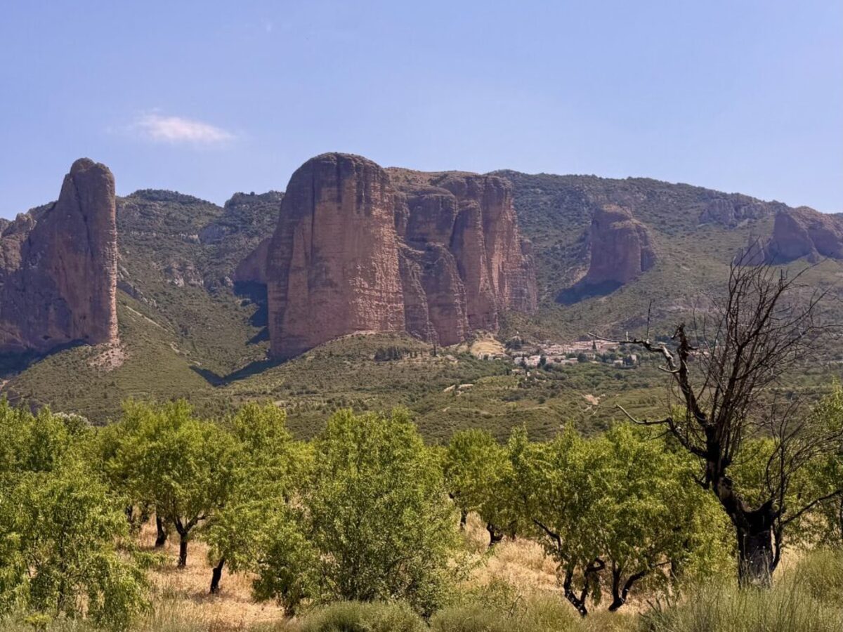  To appreciate the scale of the Mallos de Riglos, a popular climbing destination, look for the itty bitty village at the base. Photo credit: Cathy Bennett Kopf 