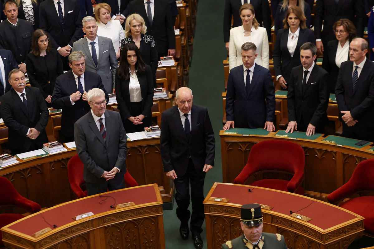 Hungary's President Tamas Sulyok walks as nominee for Speaker of the Parliament Agnes Forsthoffer, Hungary's Prime Minister-elect Peter Magyar and Marton Mellethei-Barna stand during the inaugural session of Hungary's parliament in Budapest, Hungary, May 9, 2026. REUTERS/Bernadett Szabo