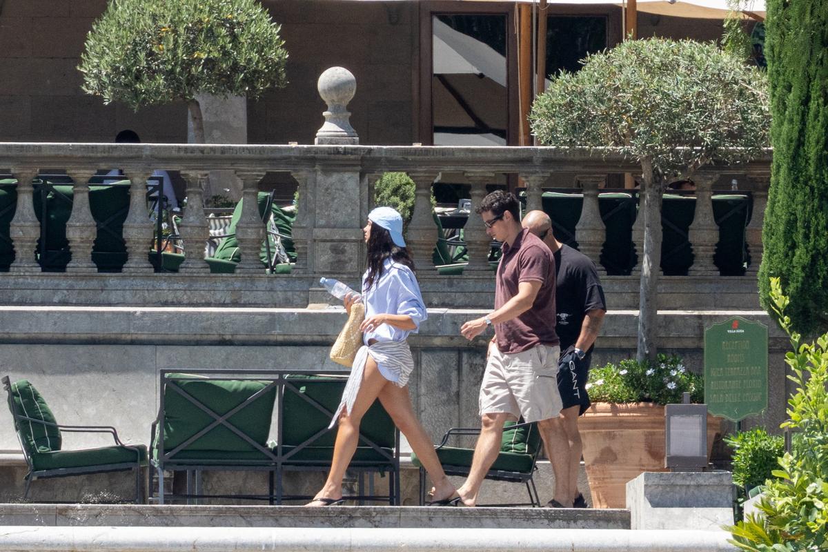 Dua Lipa and Callum Turner walk near the restaurant at Grand Hotel Villa Igiea, where the first guests are gathering ahead of the couple's wedding celebrations, in Palermo, Italy, June 4, 2026. REUTERS/Igor Petyx