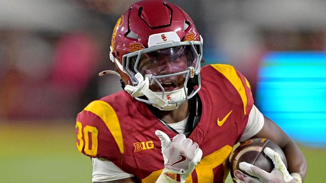  Oct 11, 2025; Los Angeles, California, USA; USC Trojans running back King Miller (30) runs for a touchdown in the second half against the Michigan Wolverines at United Airlines Field at the Los Angeles Memorial Coliseum. Mandatory Credit: Jayne Kamin-Oncea-Imagn Images | Jayne Kamin-Oncea-Imagn Images 