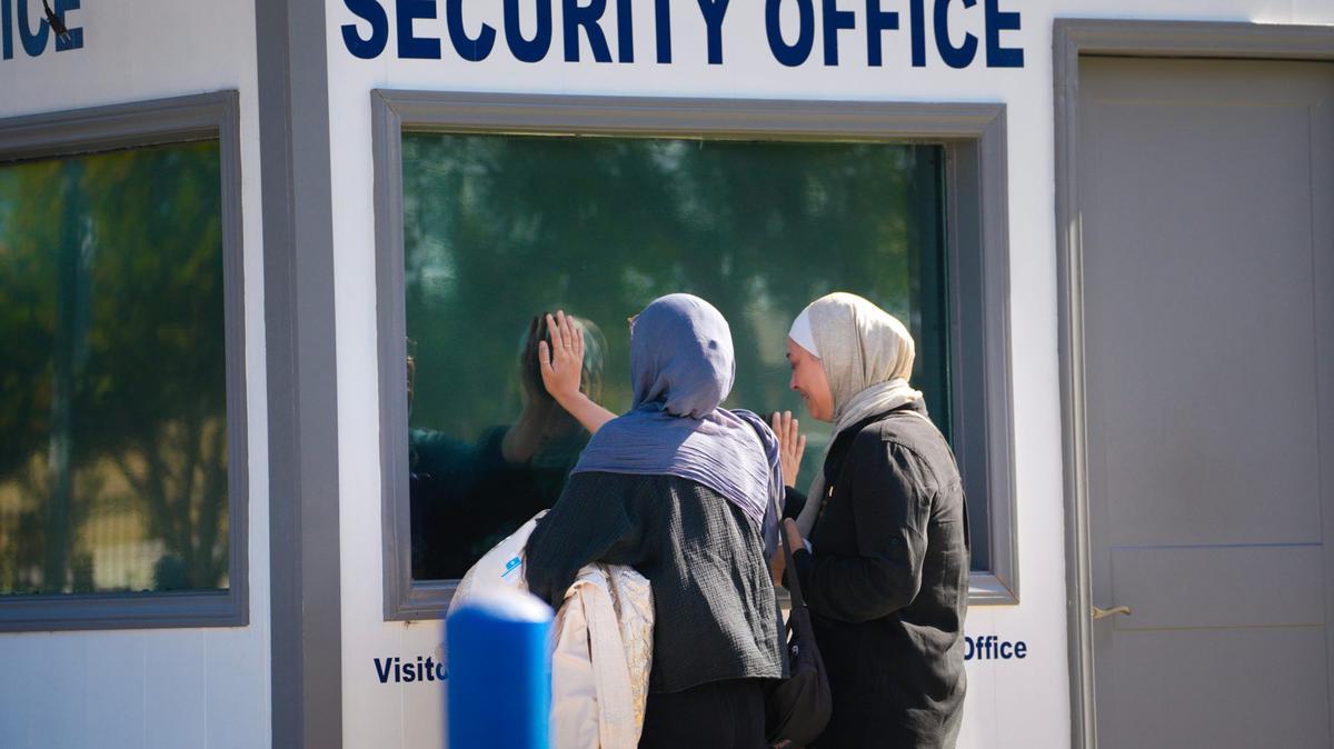 The day after a gunman shot and killed three people at the Islamic Center of San Diego, two unidentified women grieve for the security officer who was killed at the Islamic Center of San Diego on Tuesday, May 19, 2026, in San Diego. (Nelvin C. Cepeda/The San Diego Union-Tribune/TNS)