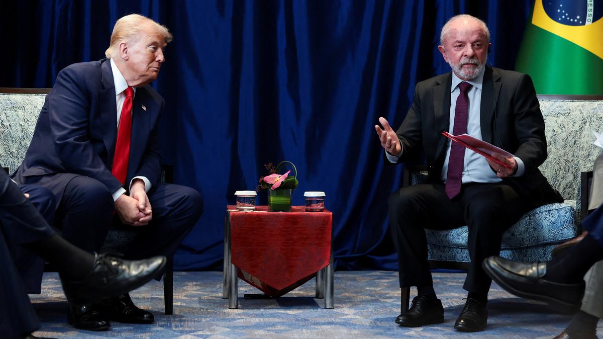 U.S. President Donald Trump listens to Brazilian President Luiz Inacio Lula da Silva speak as they meet on the sidelines of the 47th Association of Southeast Asian Nations (ASEAN) summit in Kuala Lumpur, Malaysia, October 26, 2025. REUTERS/Evelyn Hockstein
