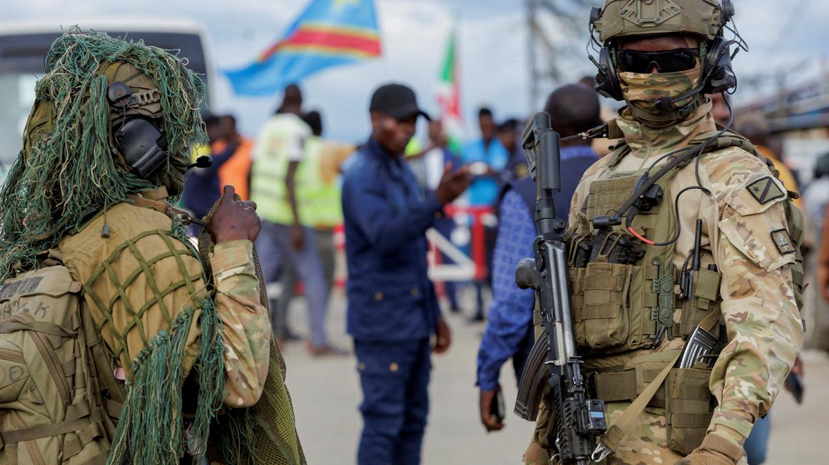 Congolese soldiers stand guard during the repatriation of Congolese refugees from Busuma camp in Democratic Republic of Congo, April 23, 2026. REUTERS/Evrard Ngendakumana