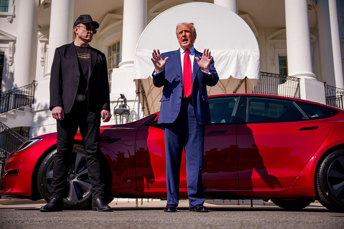 President Donald Trump, accompanied by White House senior advisor, Tesla and SpaceX CEO Elon Musk, speaks next to a Tesla Model S on the South Lawn of the White House on March 11. Trump spoke out against calls for a boycott of Musk’s companies and said he would purchase a Tesla in a “show of confidence and support” for Musk.