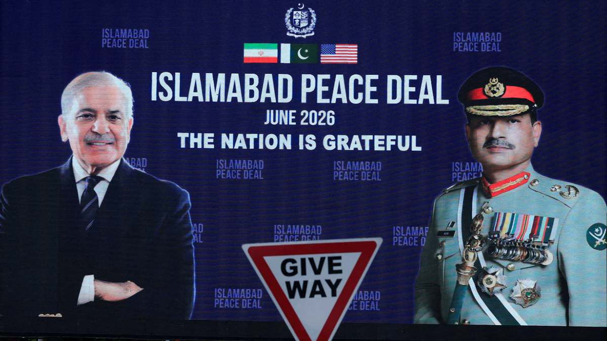 FILE PHOTO: A roadside billboard displaying portraits of Pakistan's Chief of Army Staff Field Marshal Asim Munir and Prime Minister Shehbaz Sharif, following a deal between the U.S. and Iran, in Islamabad, Pakistan, June 16, 2026. REUTERS/Akhtar Soomro/File Photo