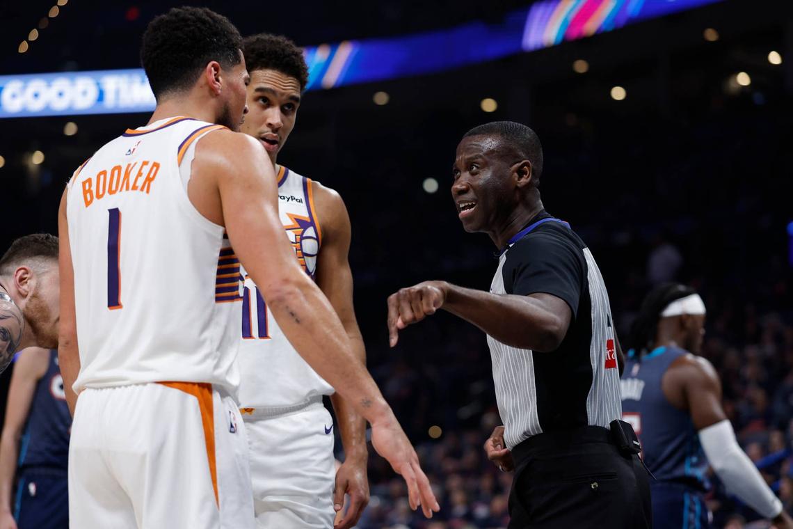  Apr 22, 2026; Oklahoma City, Oklahoma, USA; NBA referee James Williams talks to Phoenix Suns guard Devin Booker (1) in the second half during game two of the first round of the 2026 NBA Playoffs against the Oklahoma City Thunder at Paycom Center. Mandatory Credit: Alonzo Adams-Imagn Images 