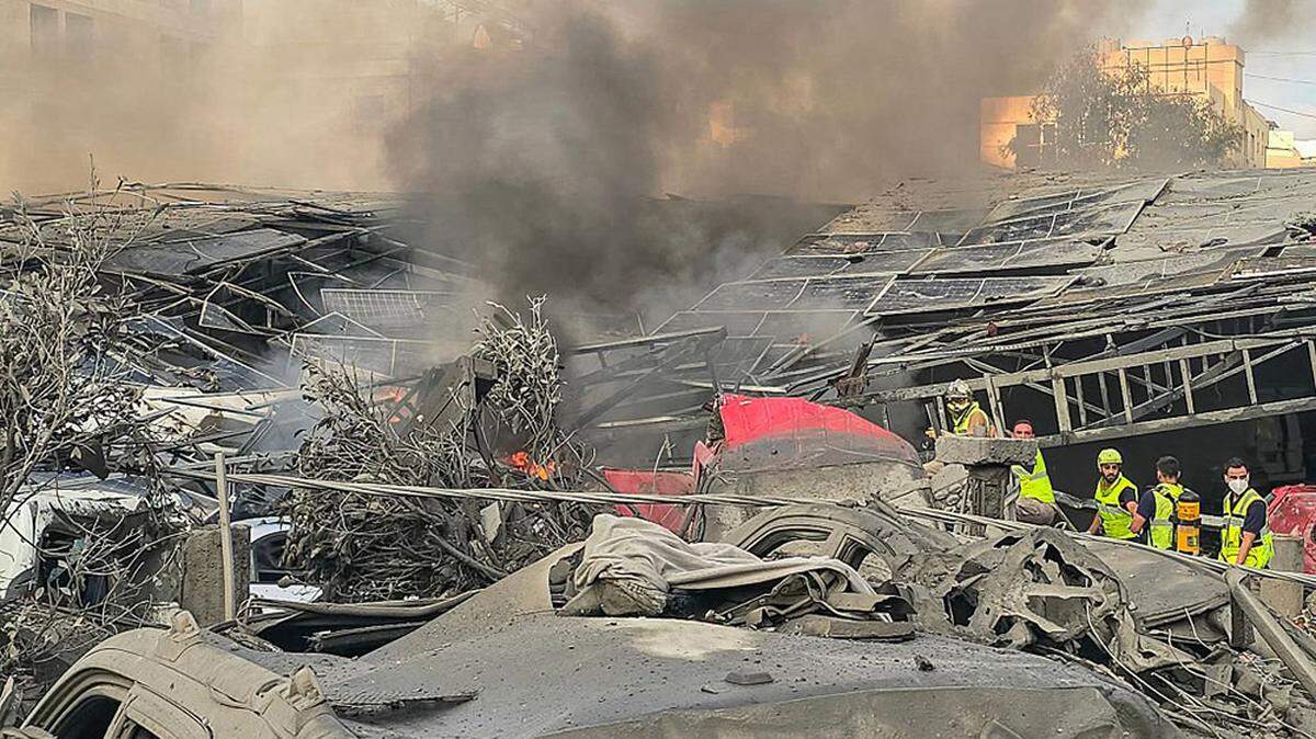 First responders gather at the site of an Israeli strike that hit near a hospital in the southern Lebanese city of Tyre on Monday.