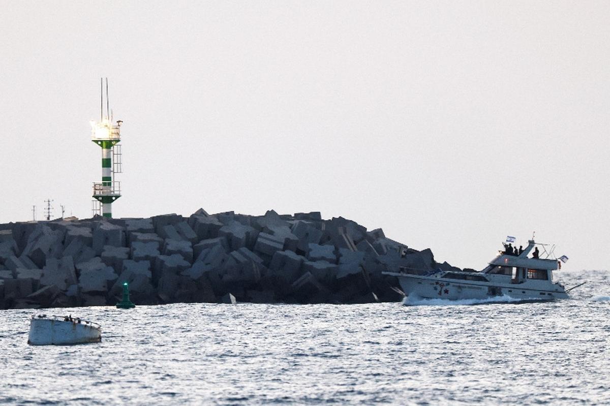 Israeli soldiers are seen on a vessel bearing symbols of the Global Sumud Flotilla, as it is brought into the port in Ashdod, southern Israel, May 19, 2026. REUTERS/Amir Cohen