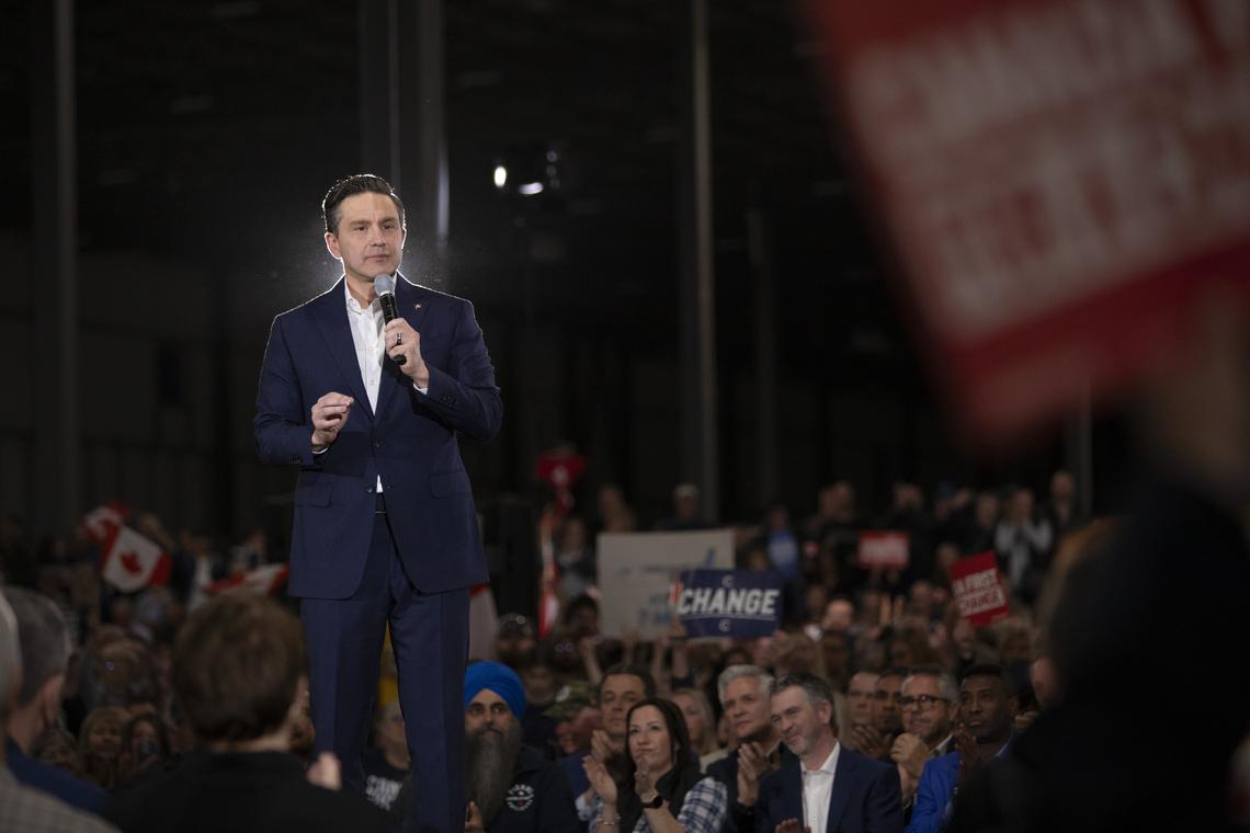FILE -- Pierre Poilievre, the Conservative leader, speaks during a rally in Nisku, Alberta, April 7, 2026. Prime Minister Mark Carney of Canada, who heads a minority government, is expected to gain a majority in the House of Commons after three special elections on Monday. A Liberal majority would be another blow to Poilievre. (Amber Bracken/The New York Times)