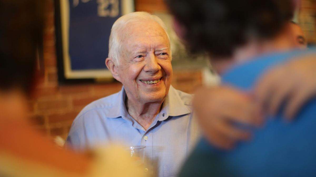 President Jimmy Carter smiles while greeting friends, family and fans at a fundraiser and birthday party for his wife Rosalynn on Aug. 22, 2015, in Plains.