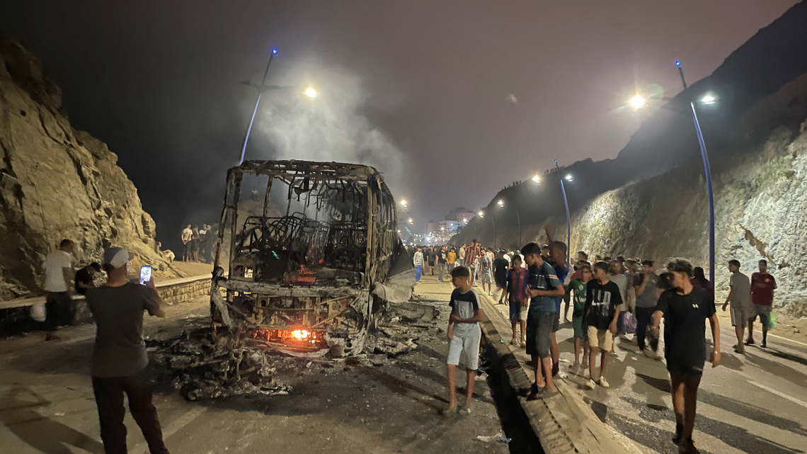 Sleepless night near border of Spain's Ceuta as migrants torch vehicles 